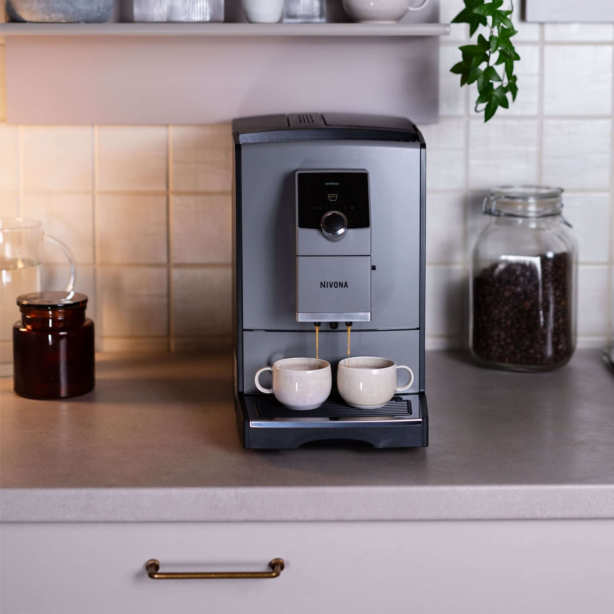 NICR 793 CafeRomatica Fully Automatic Espresso Machine brewing two cups of espresso on a kitchen counter.