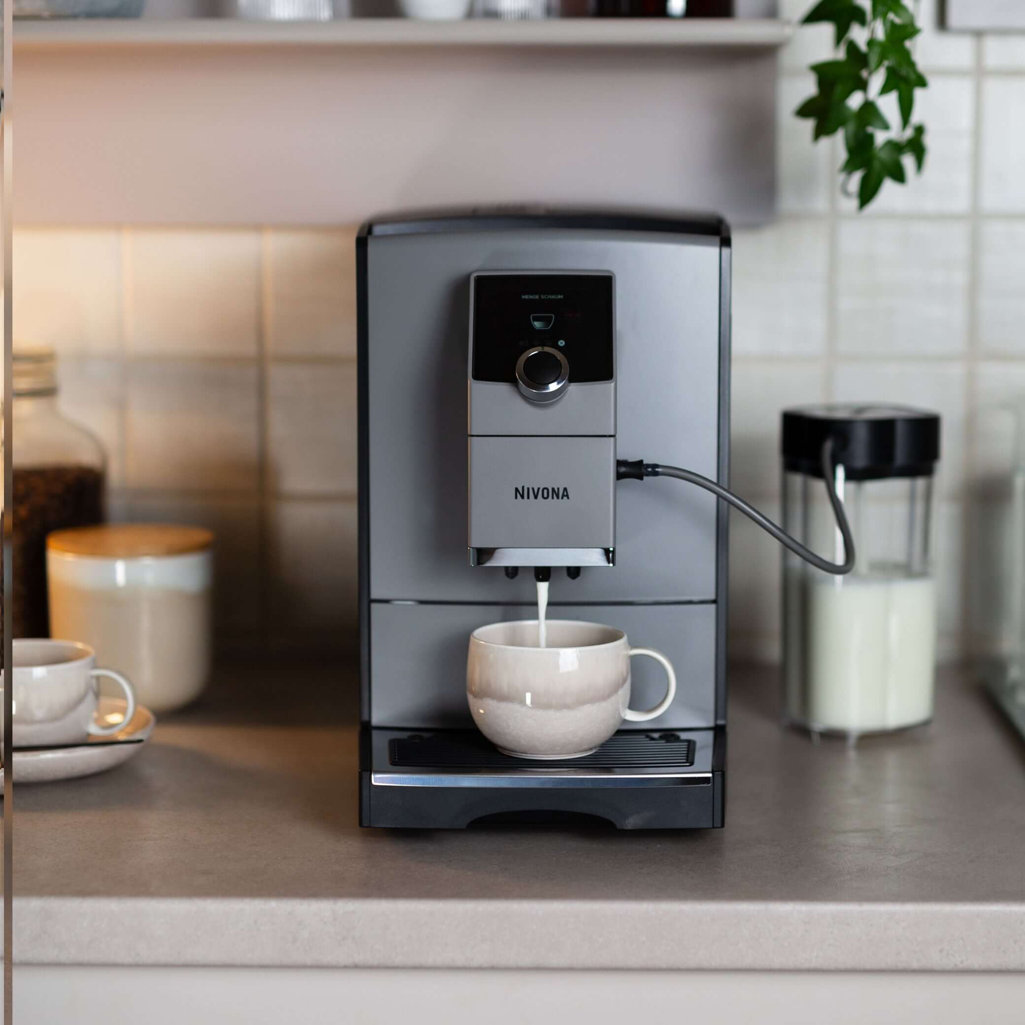 NICR 793 CafeRomatica Fully Automatic Espresso Machine making fresh coffee in a modern kitchen setting.
