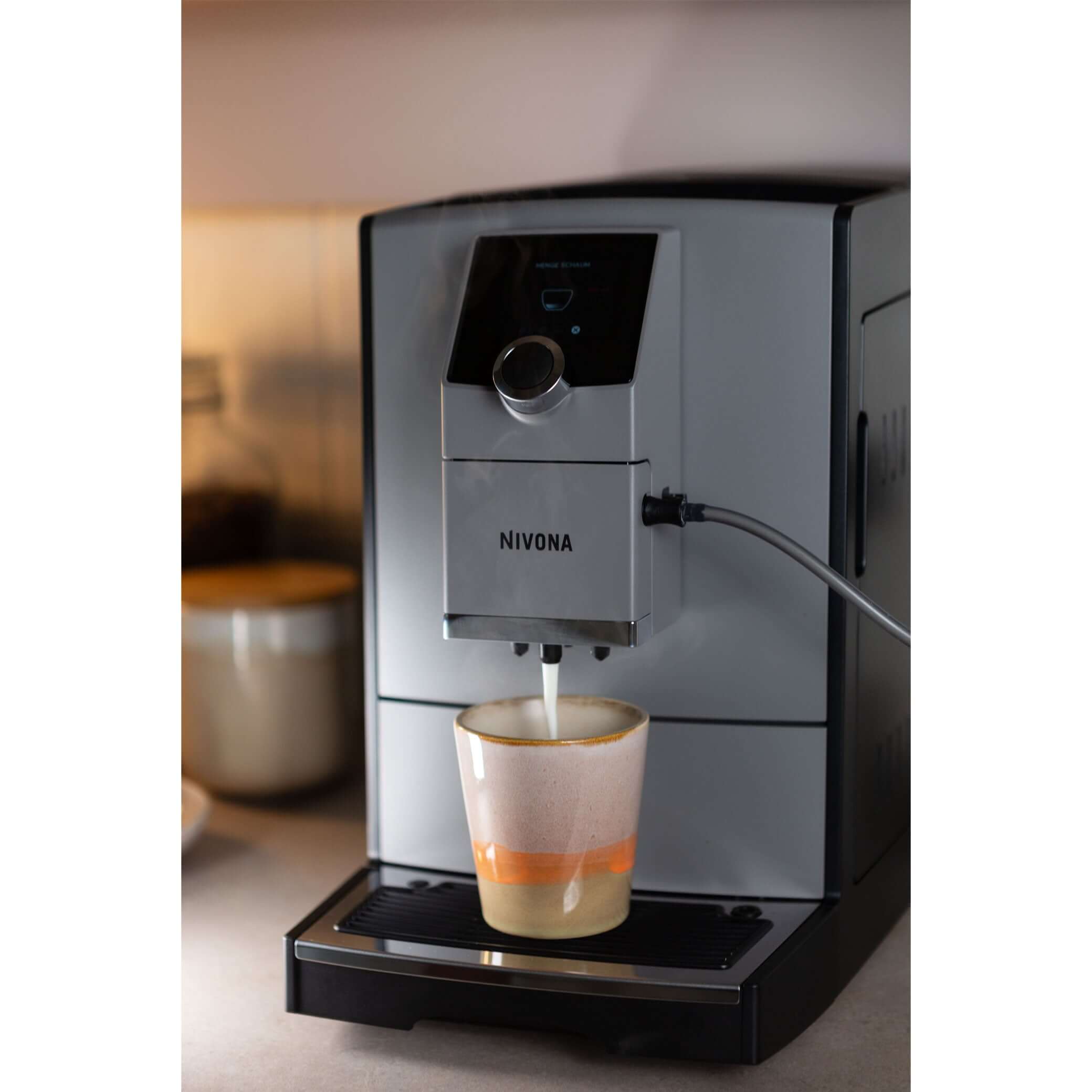 NICR 793 CafeRomatica Fully Automatic Espresso Machine brewing a latte macchiato.