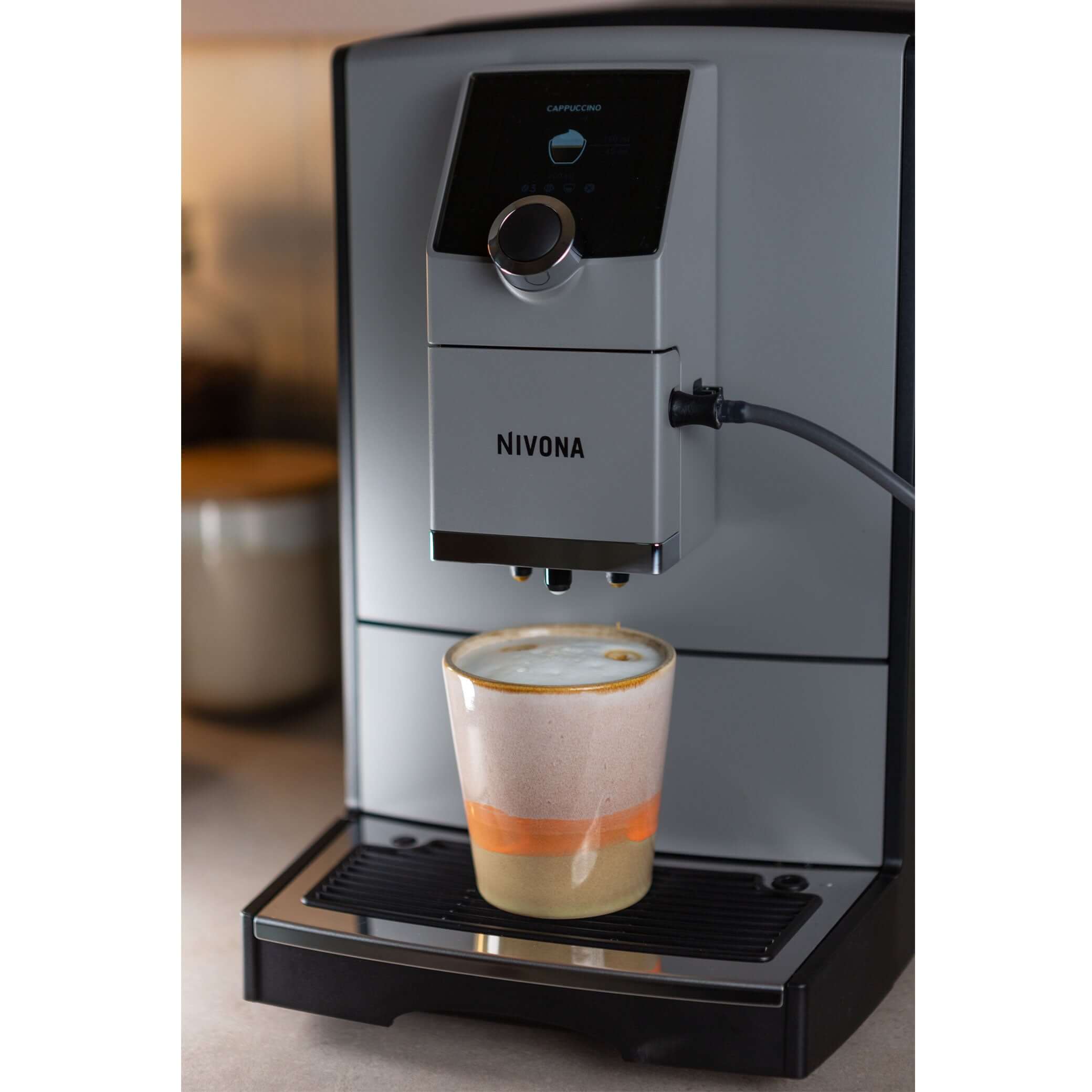NICR 793 CafeRomatica Fully Automatic Espresso Machine brewing a latte macchiato.