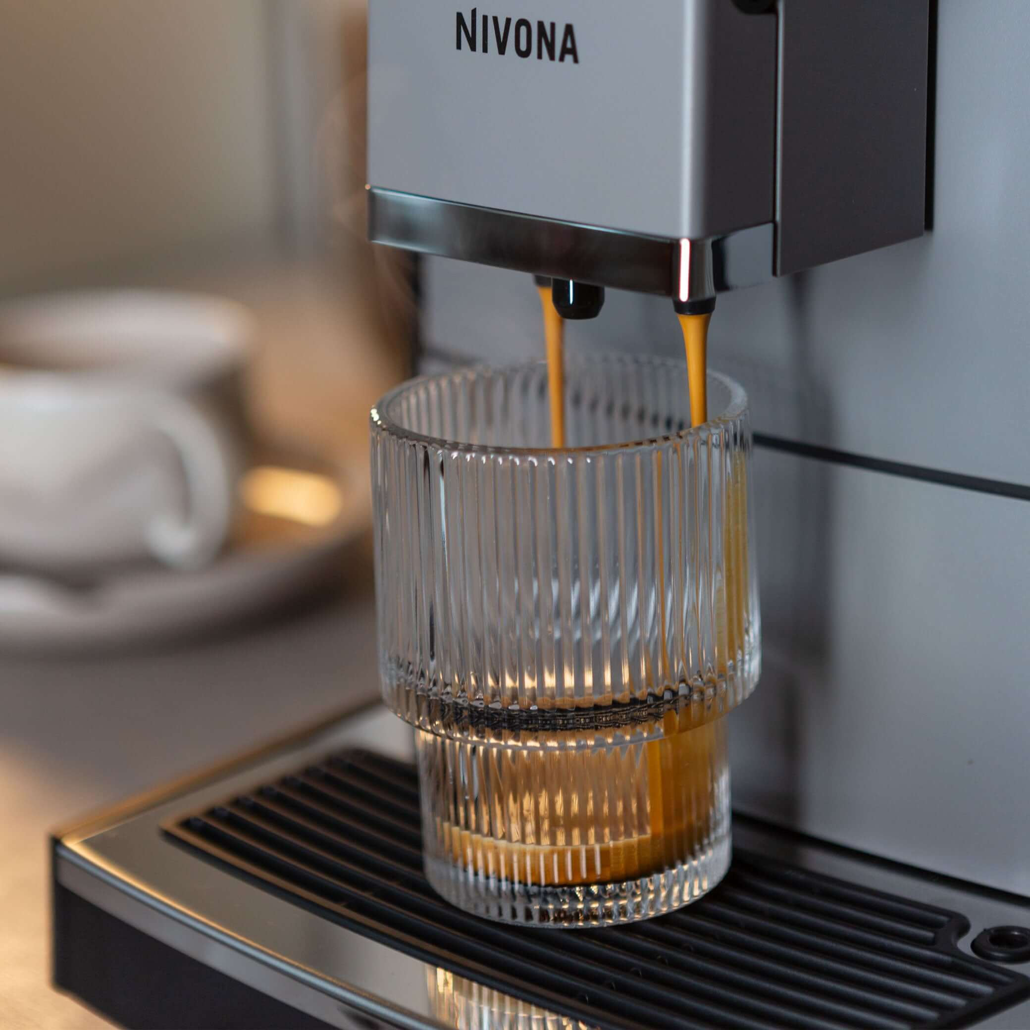 NICR 793 CafeRomatica Fully Automatic Espresso Machine brewing a latte macchiato.