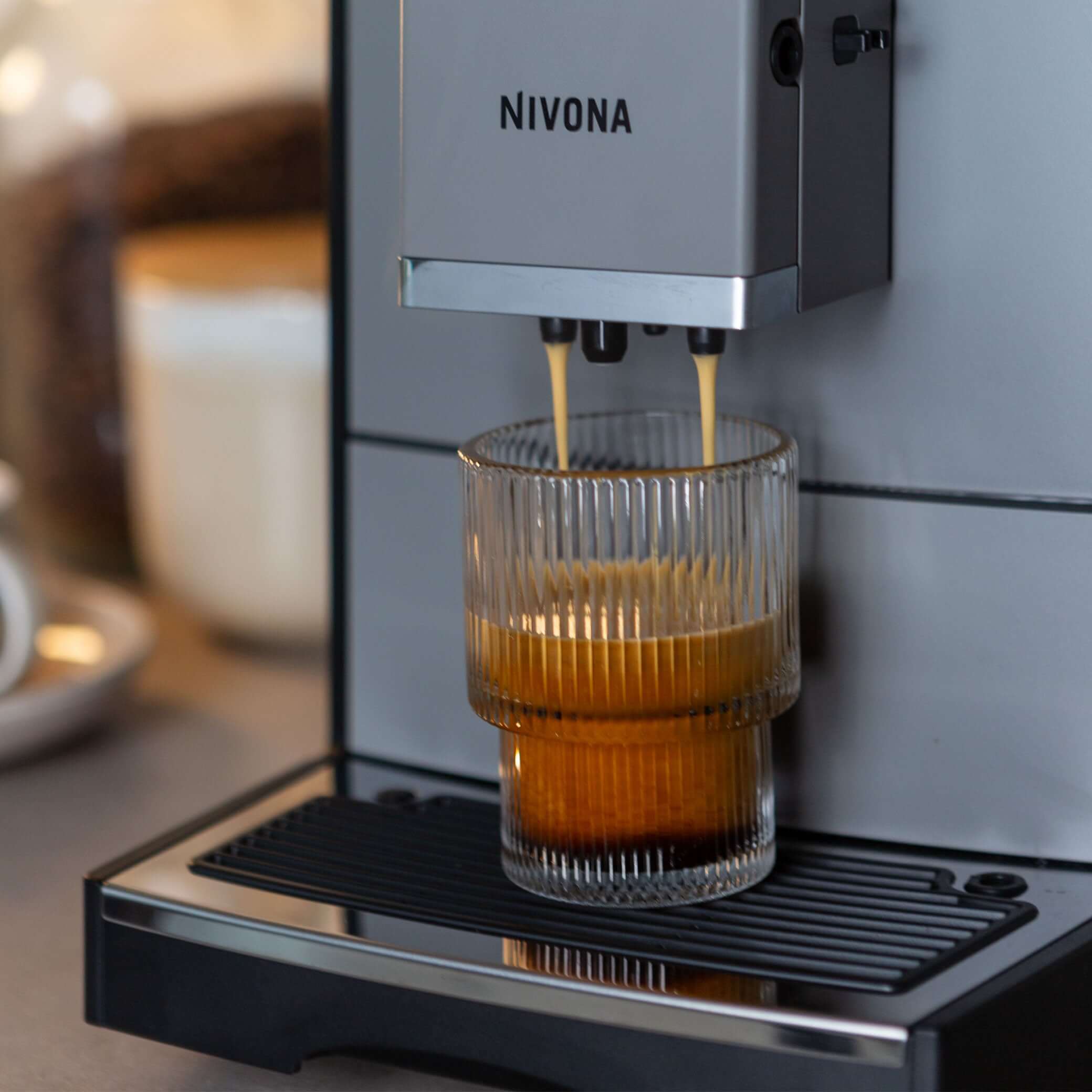 NICR 793 CafeRomatica Fully Automatic Espresso Machine brewing a latte macchiato.