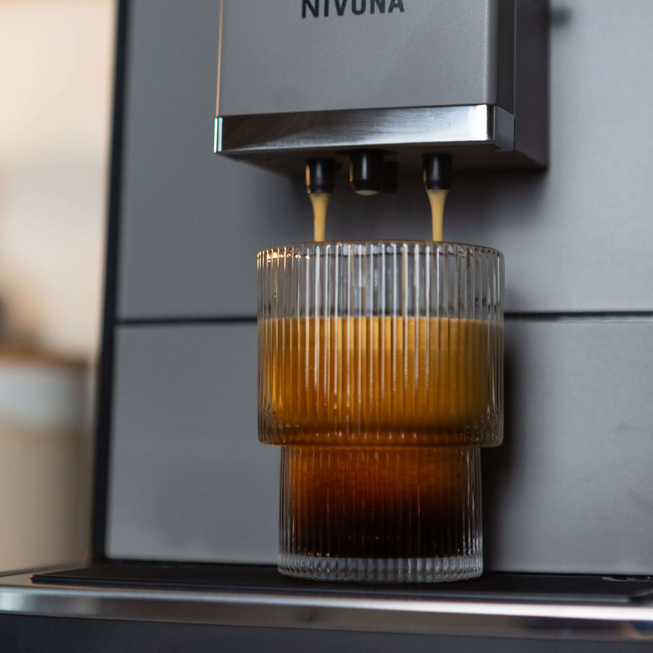 NICR 793 CafeRomatica Fully Automatic Espresso Machine brewing a latte macchiato.