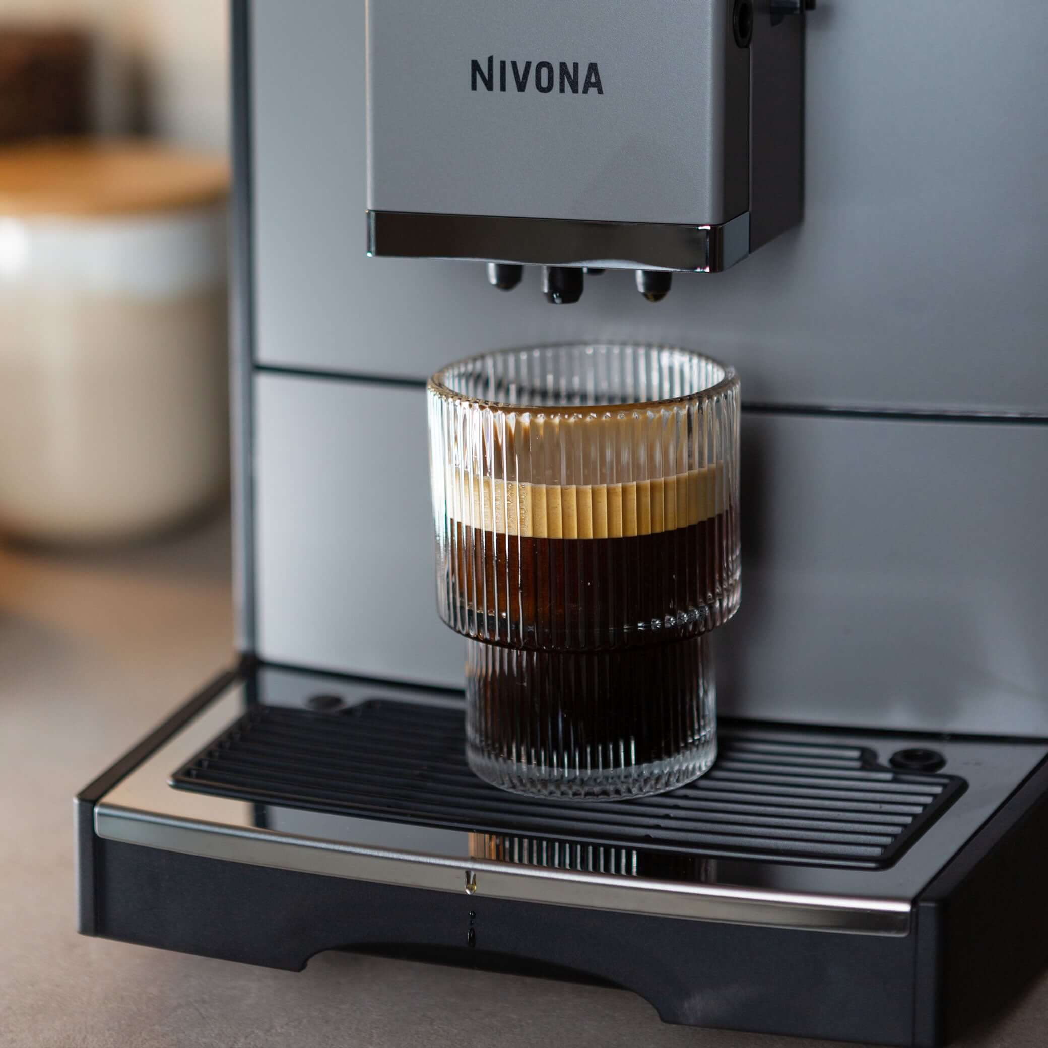 NICR 793 CafeRomatica Fully Automatic Espresso Machine brewing a latte macchiato.