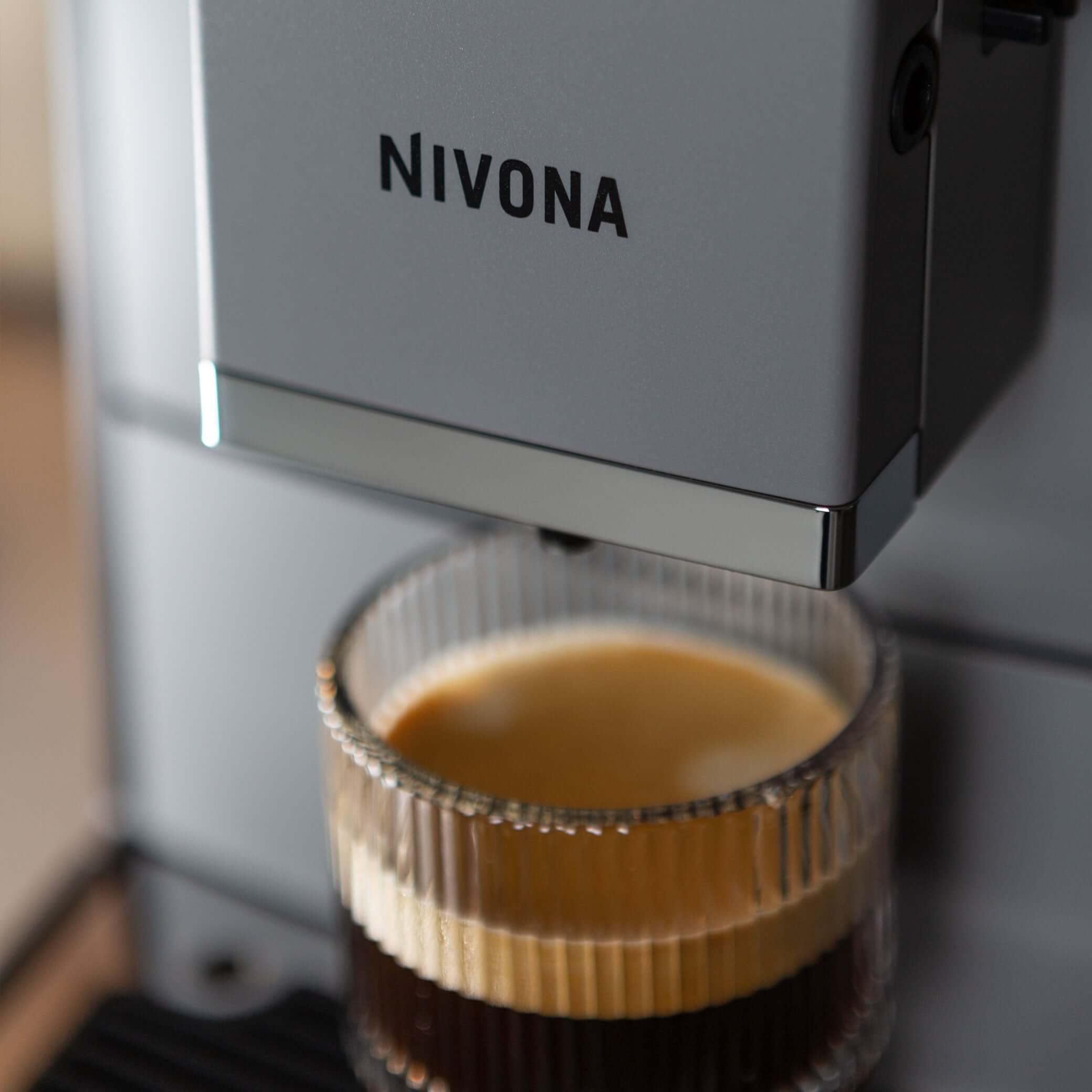 NICR 793 CafeRomatica Fully Automatic Espresso Machine brewing a latte macchiato.