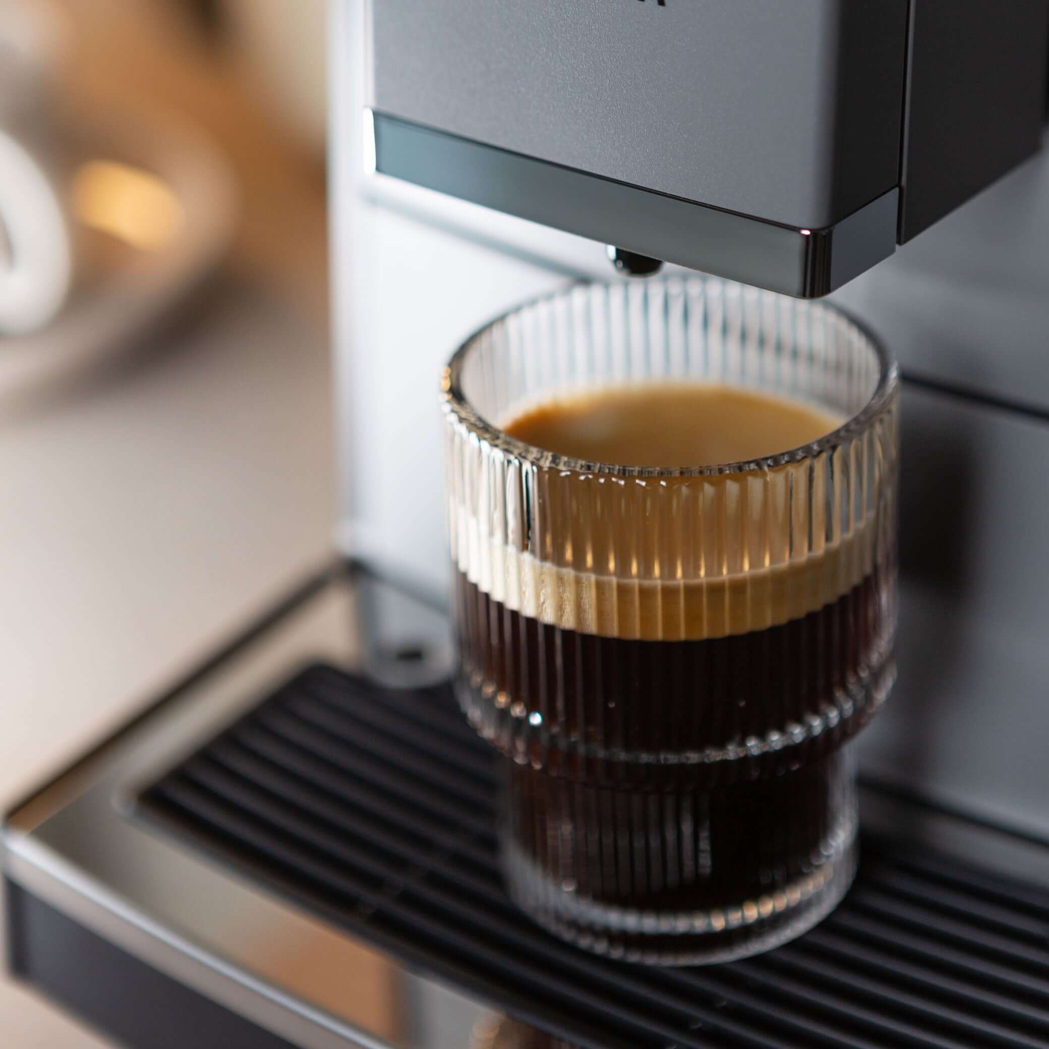 NICR 793 CafeRomatica Fully Automatic Espresso Machine brewing a latte macchiato.