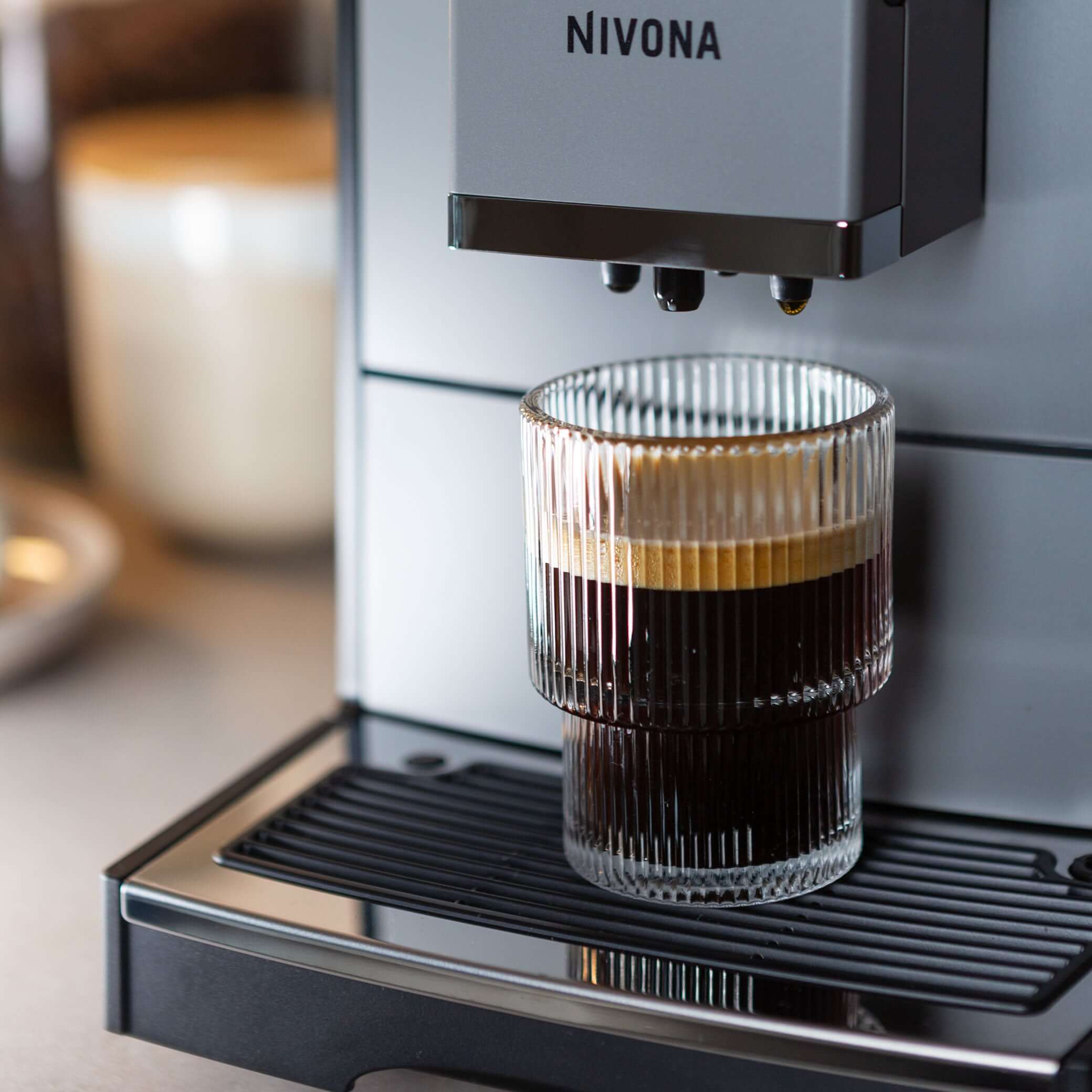 NICR 793 CafeRomatica Fully Automatic Espresso Machine brewing a latte macchiato.