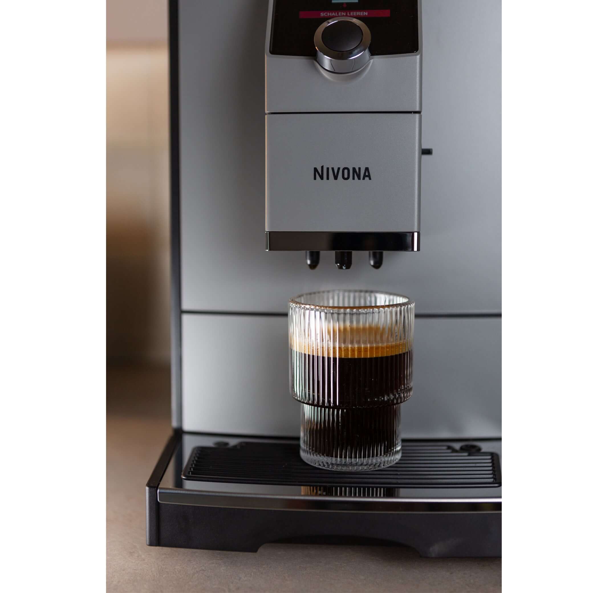 NICR 793 CafeRomatica Fully Automatic Espresso Machine brewing a latte macchiato.