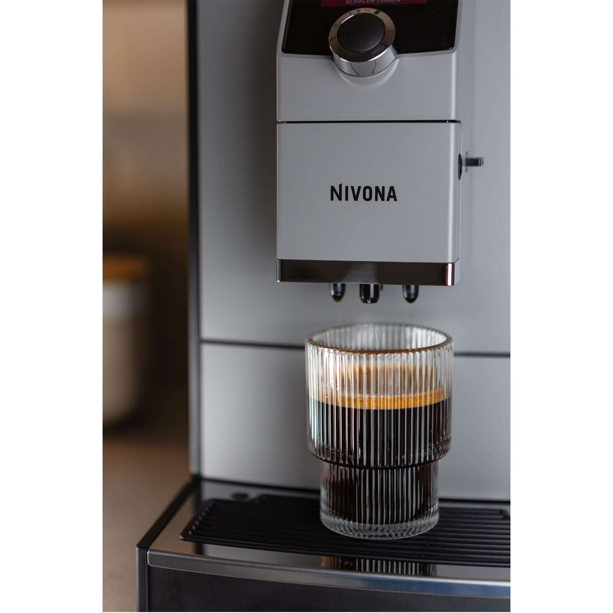 NICR 793 CafeRomatica Fully Automatic Espresso Machine brewing a latte macchiato.