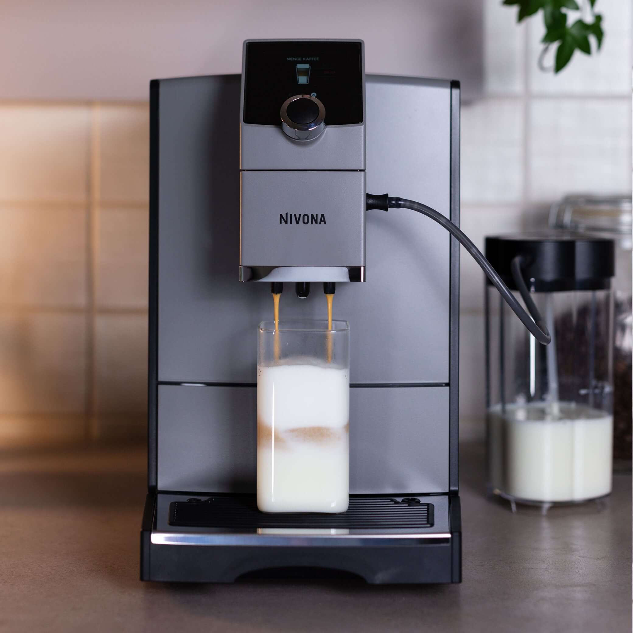 NICR 793 CafeRomatica Fully Automatic Espresso Machine brewing a latte with milk froth.