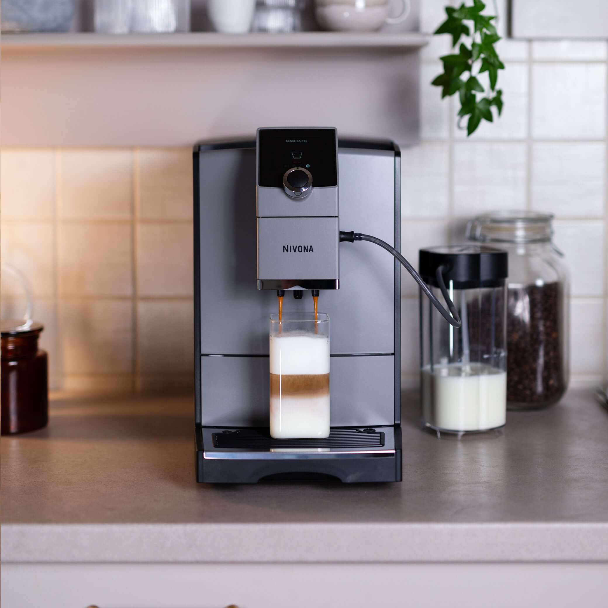 NICR 793 CafeRomatica Fully Automatic Espresso Machine making a creamy coffee drink on a kitchen countertop.