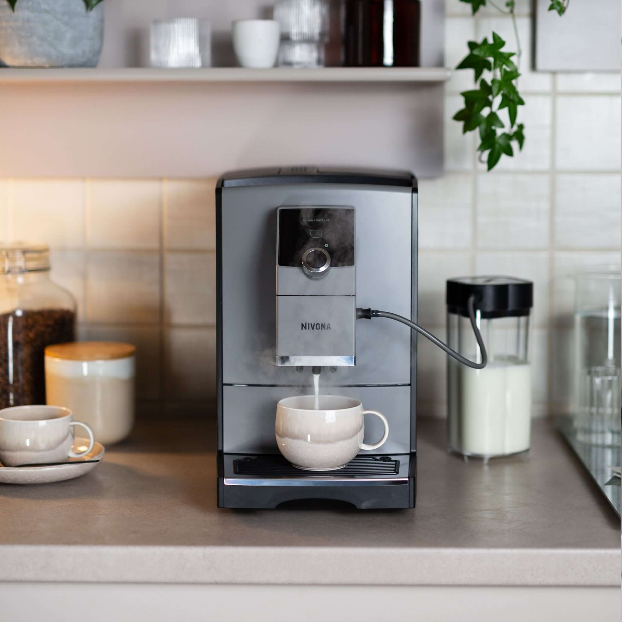 NICR 793 CafeRomatica Fully Automatic Espresso Machine brewing espresso into a cup on a kitchen counter.