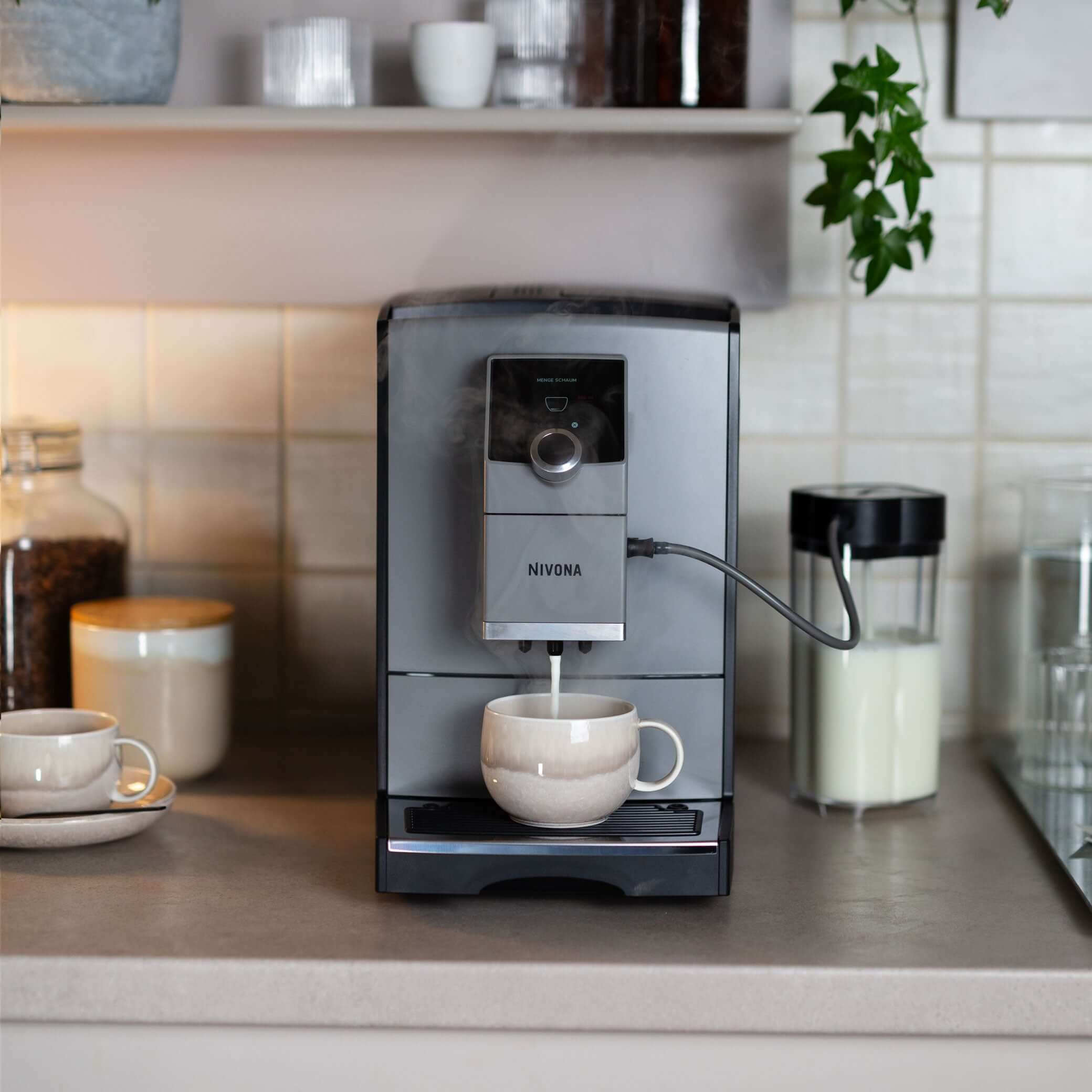 NICR 793 CafeRomatica Fully Automatic Espresso Machine brewing coffee in modern kitchen setting.